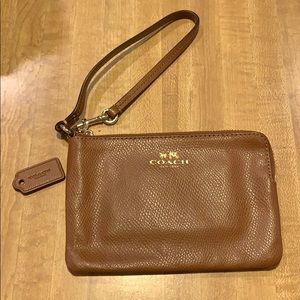 Coach light brown leather wristlet. Good condition